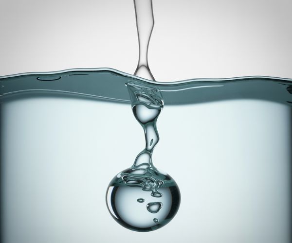 It is less viscous than water, causing it to rise