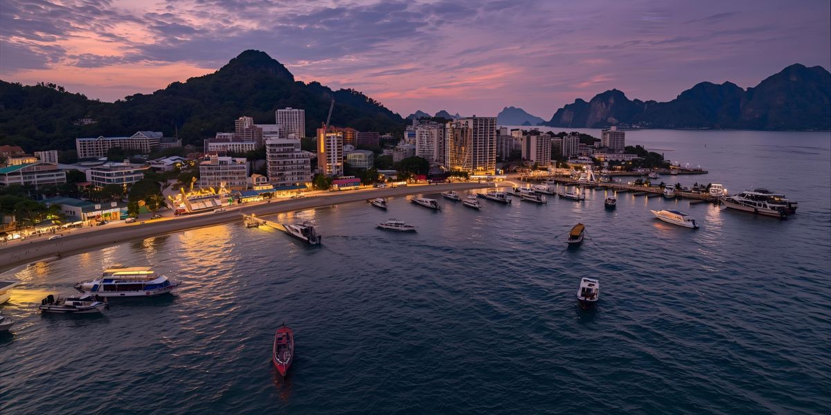 Phuket features long-tail boats, lively night markets, and trips to the Phi Phi Islands. Which country is it located in