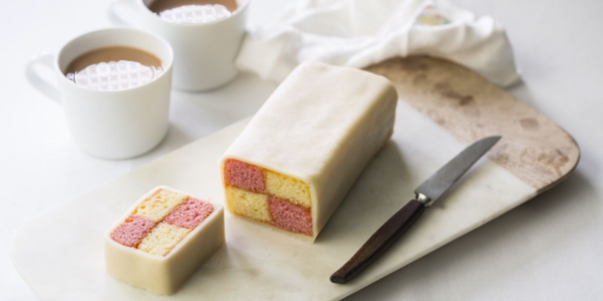 This classic British cake, featuring a pink and yellow checkerboard pattern, takes its name from a German city. What is it called