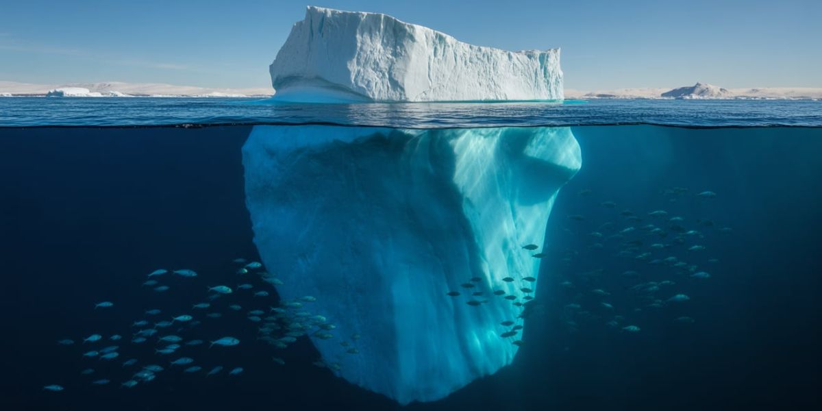 What portion of an iceberg is usually visible above the surface of the water