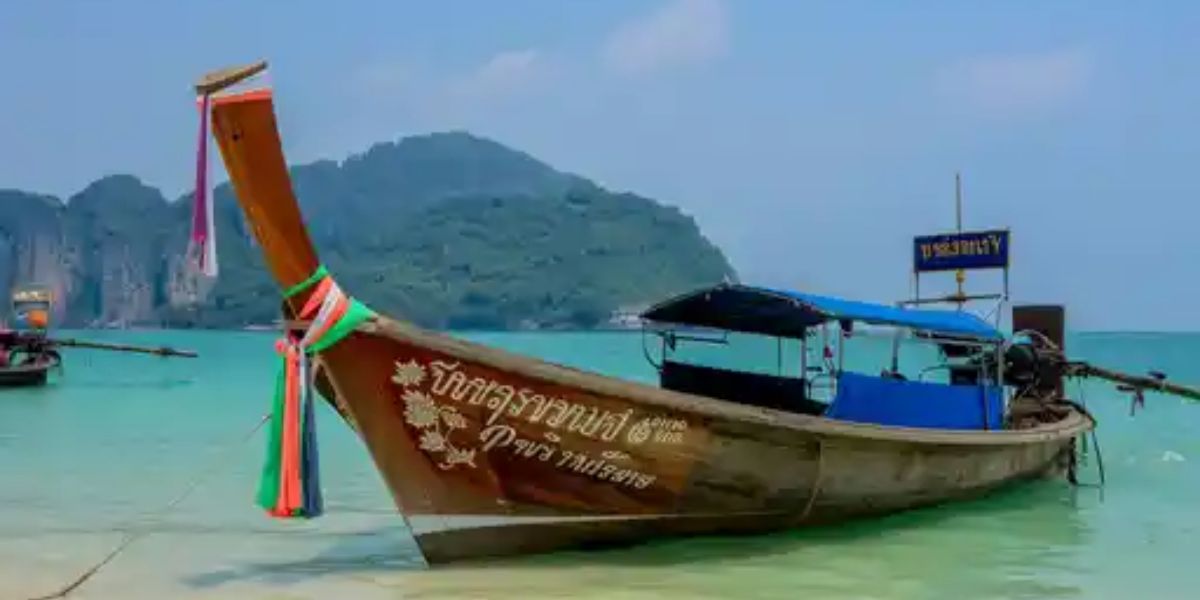 Phuket is known for its long-tail boats, vibrant night markets, and excursions to Phi Phi Island. In which country is it located