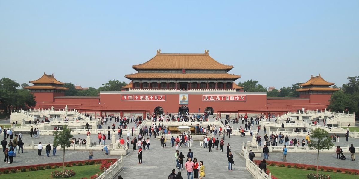 The Forbidden City, renowned as the largest palace in the world, boasts 9,999 and a half rooms. Where is it located