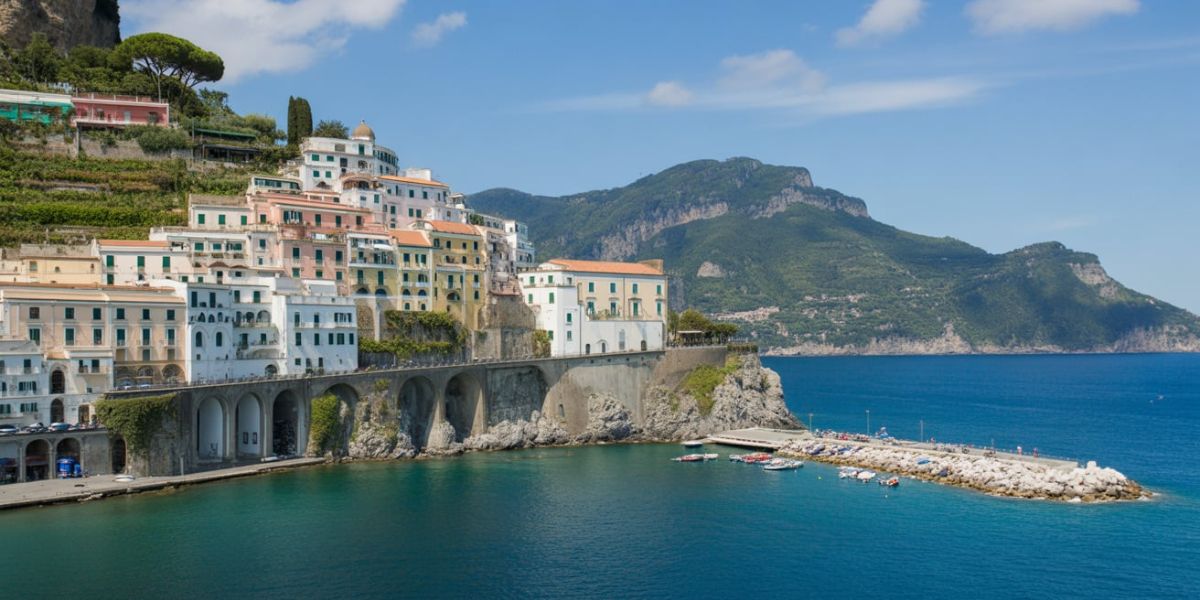 Those pastel-colored cliffside towns of the Amalfi Coast spill into the sparkling Mediterranean—what country do you need to fly to in order to see them