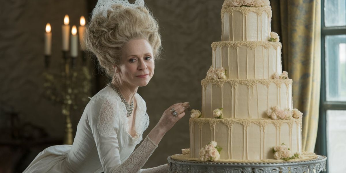 Which classic novel features Miss Havisham, whose wedding cake remains uneaten for years