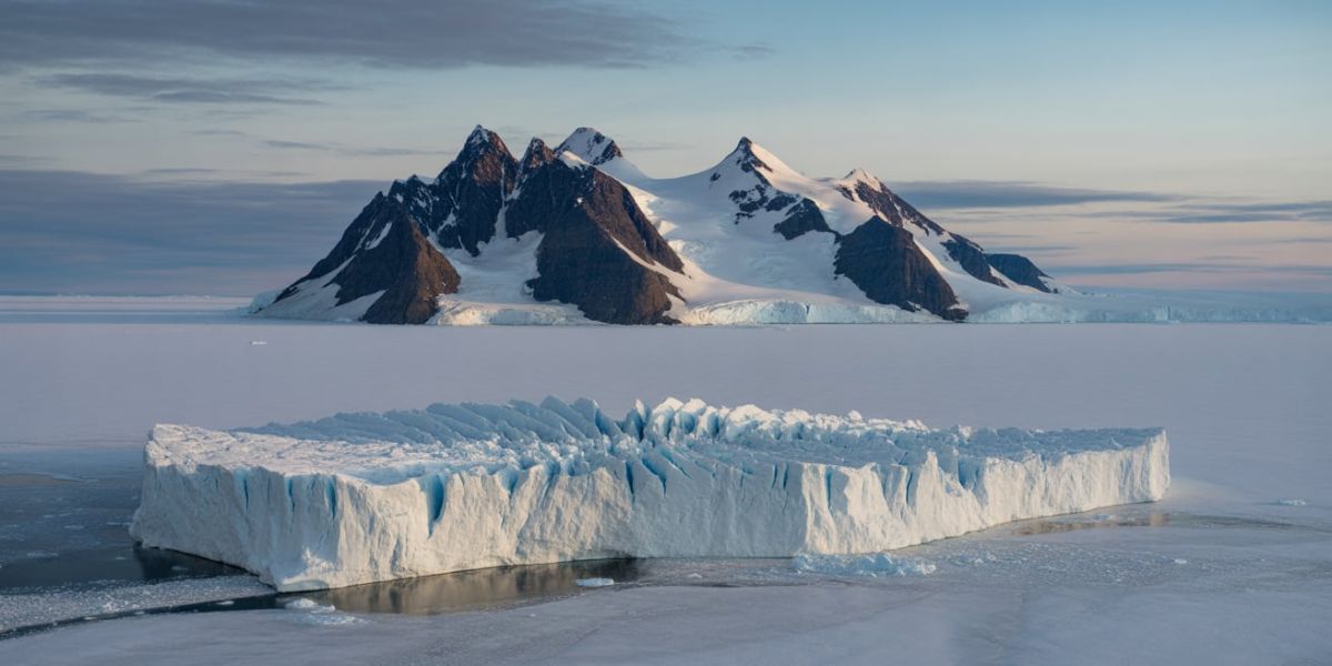 Which polar region is covered almost completely by an ice sheet